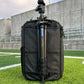 Black backpack with a camera tripod 